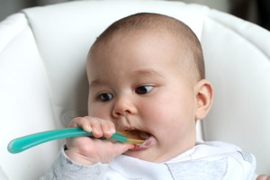 Baby with spoon