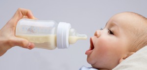 baby drinking milk from bottle
