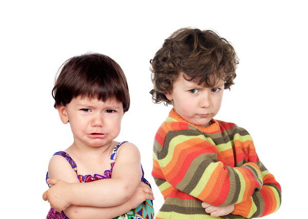 Two angry kids isolated on white background