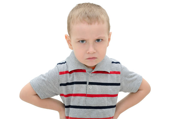 Angry little boy isolated on white background