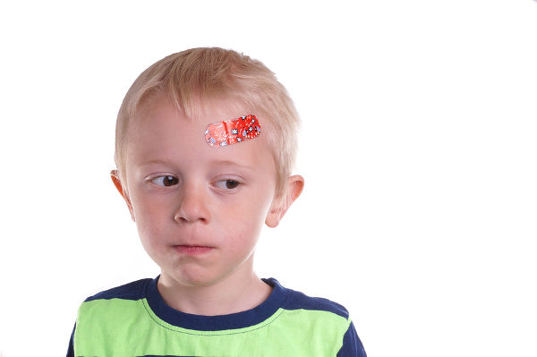 Child gets injury on the forehead has a plaster on the wound so it can heal