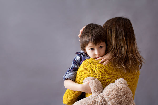 sad-child-hugging-his-mum
