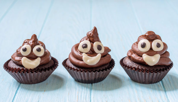Funny poop emoji chocolate cupcakes. Cute food dessert