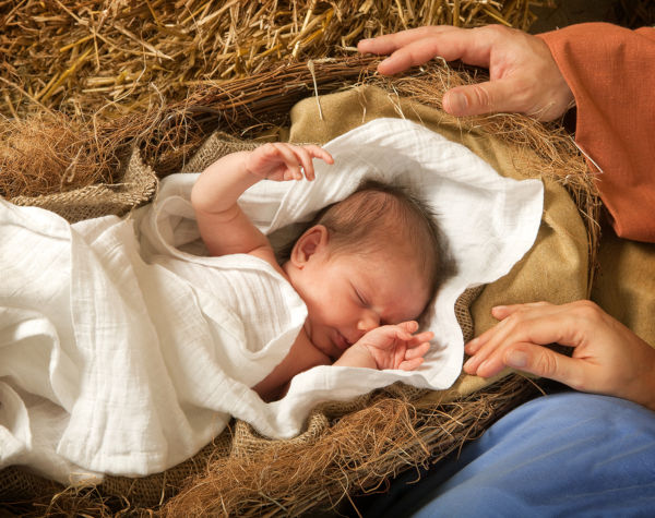 Sleeping baby in the nativity, baby Jesus on straw