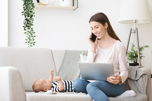 Woman working from home with a baby