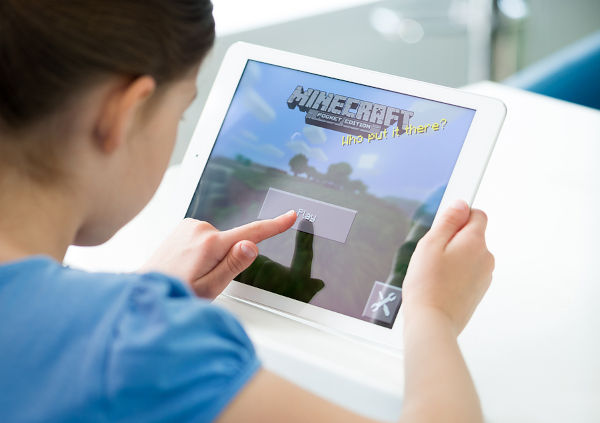 Little Girl Playing Minecraft On Apple Ipad Air