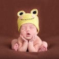 Baby sleeping in frog hat