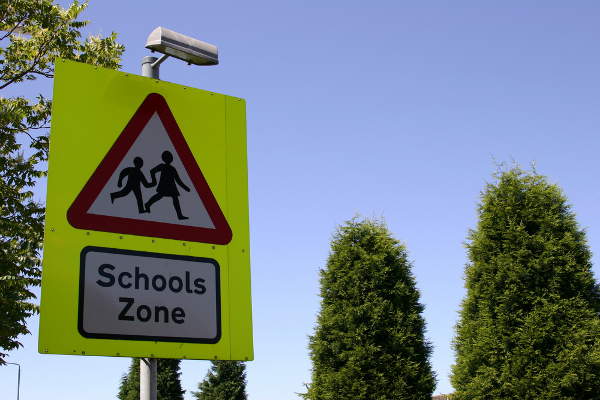 Children crossing school sign