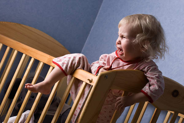 Crying baby in crib