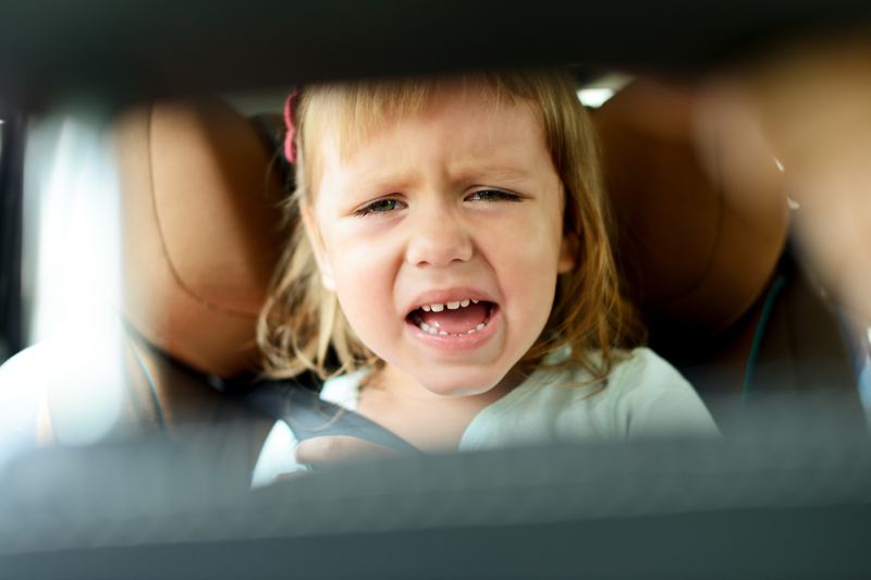 Toddler crying in rear view mirror