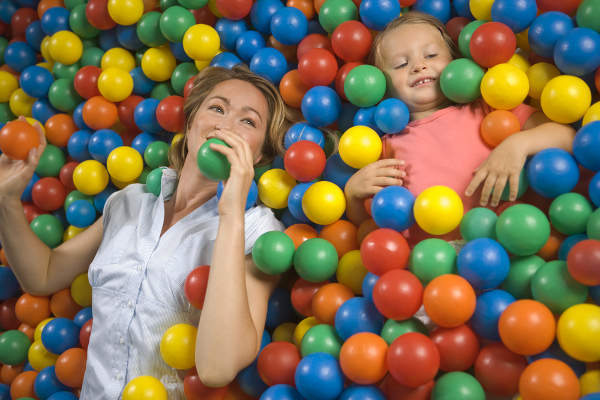 Woman and child in ball pool
