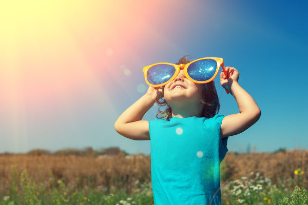 Happy little girl with big sunglasses