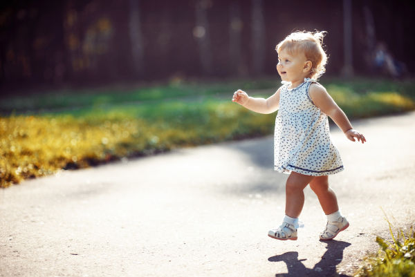 Little girl walking in park