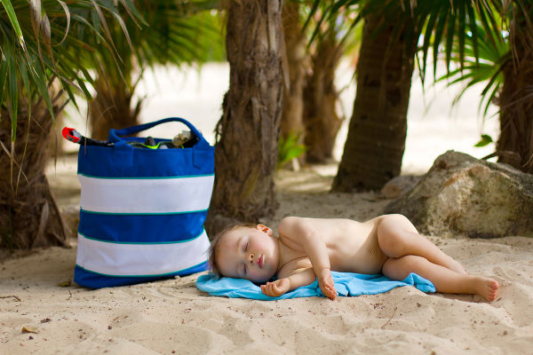 Baby asleep on beach