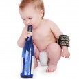 Baby blowing into glass bottle (Feature)