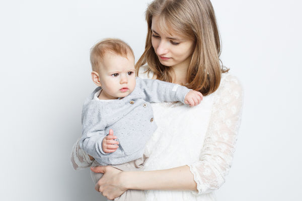 mother holding baby