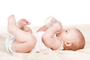 Baby drinking milk from bottle