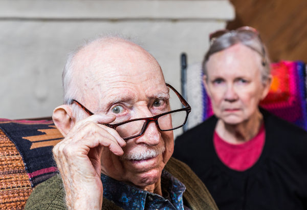 Concerned elderly couple