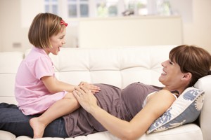 Pregnant woman with daughter