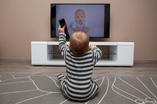 baby boy with remote controls