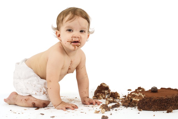 baby enjoying cake