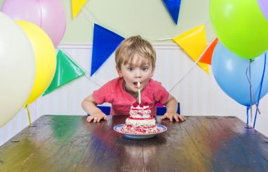 kid with birthday cake feature