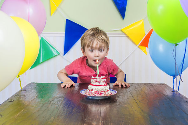 kid with birthday cake