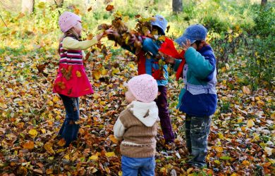 An image of children playing in the autumn park