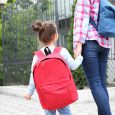 Parent taking child to school