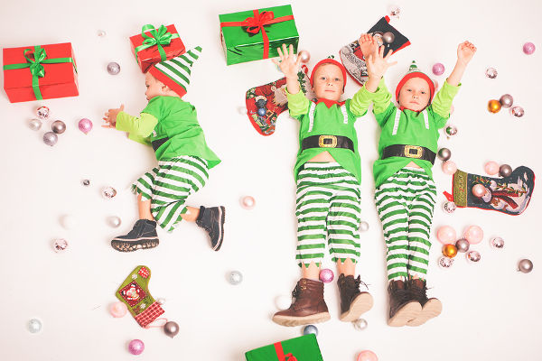 4 Kids dressed in elf costumes