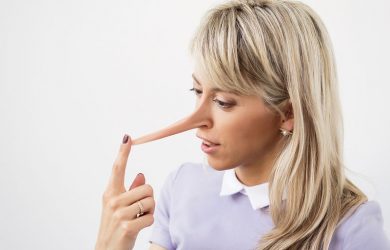 Young woman with very long liar nose