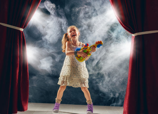 young girl rock star on stage