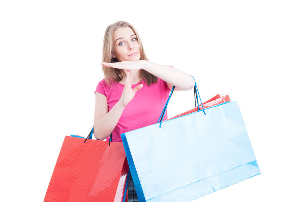 Woman doing timeout or pause gesture while doing shopping
