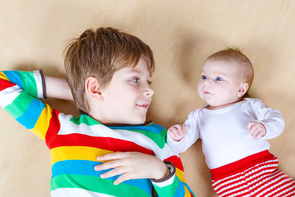 young boy with baby sister