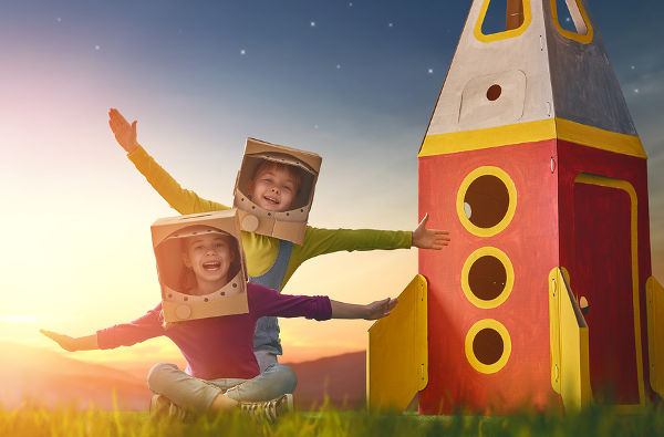 children-in-astronaut-costumes-with-cardboard-rocket-ship