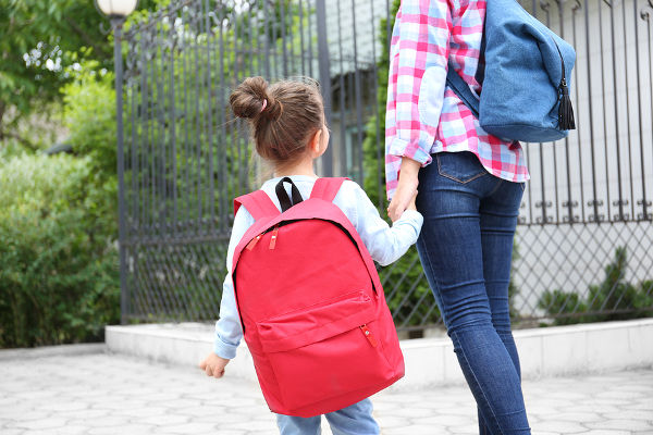 Parent taking child to school