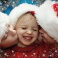 Children wearing Santa Claus hats and snowflake frame