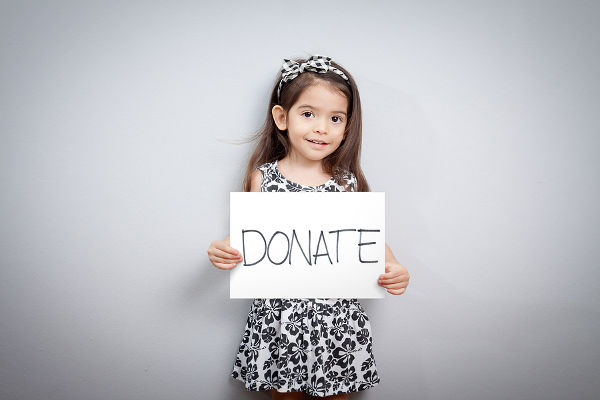 girl-with-donate-sign