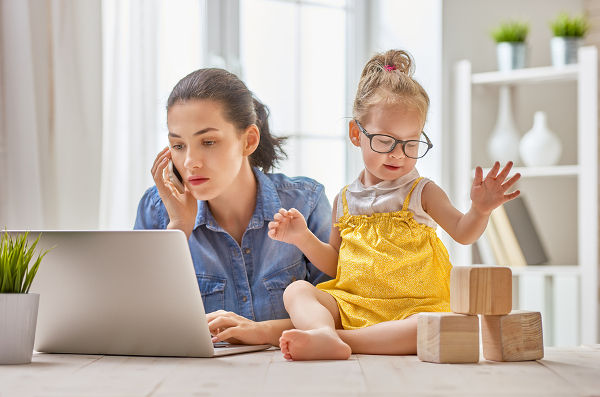 young-mother-working-toddler-playing-with-blocks