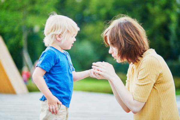 Mother Comforting Her Son After He Injur