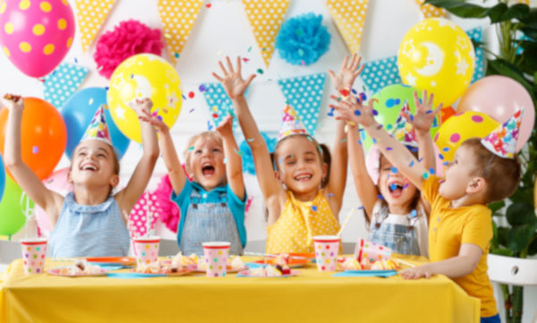 children's birthday. happy kids with cake and ballons