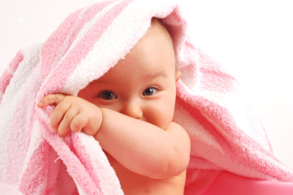 photo of happy baby girl over white background