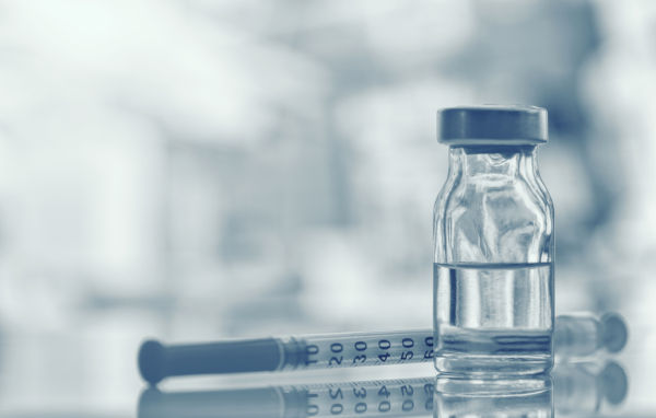 vaccine vial with needle