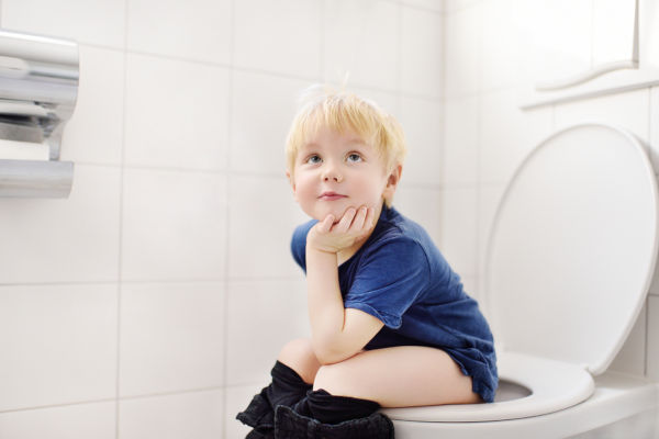 Cute Little Boy In Restroom. Toddler Child Training Use Toilet.