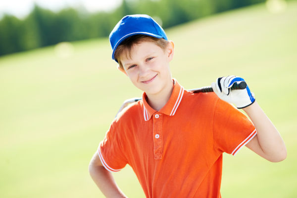 Boy golf player portrait with club