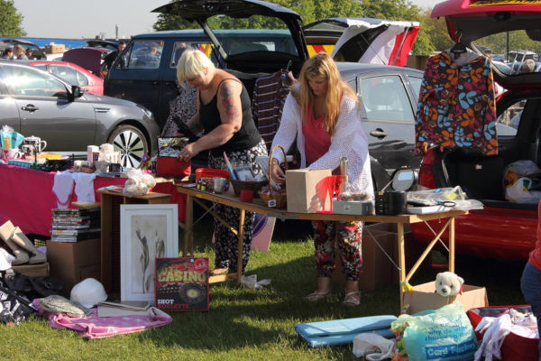 People selling at a car boot sale