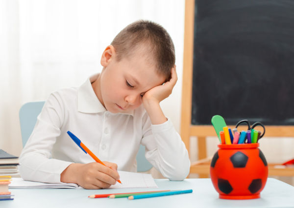 Boy working at school