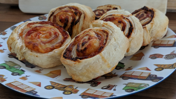 Pizza wheels made from puff pastry on a plate