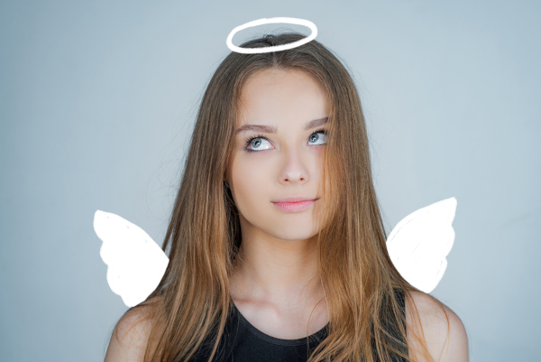 Child with cartoon angel wings and halo