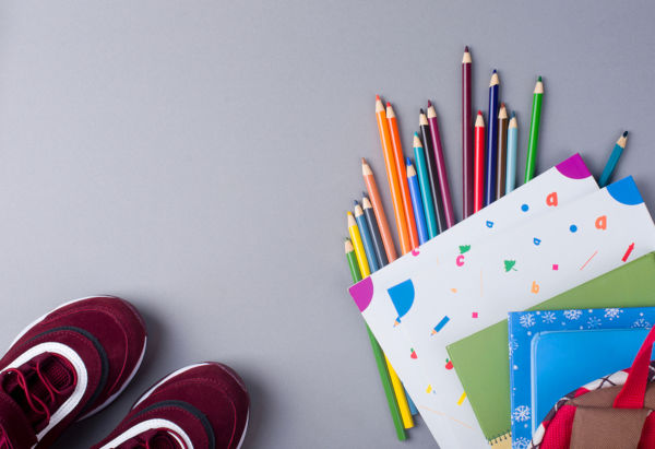 Sports Shoes With A Backpack, Books, Pencils, On The Background.